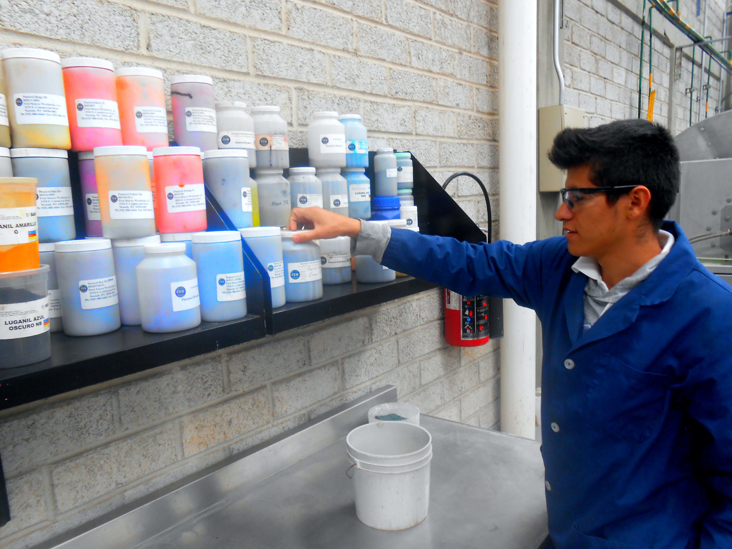 Dye samples in lab with chemist First Source Worldwide