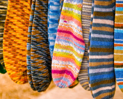 dyed knit wool fiber socks in blue orange and red