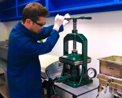 chemist working with lab equipment in paper application laboratory