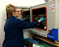 lab technician working with textile dye machines